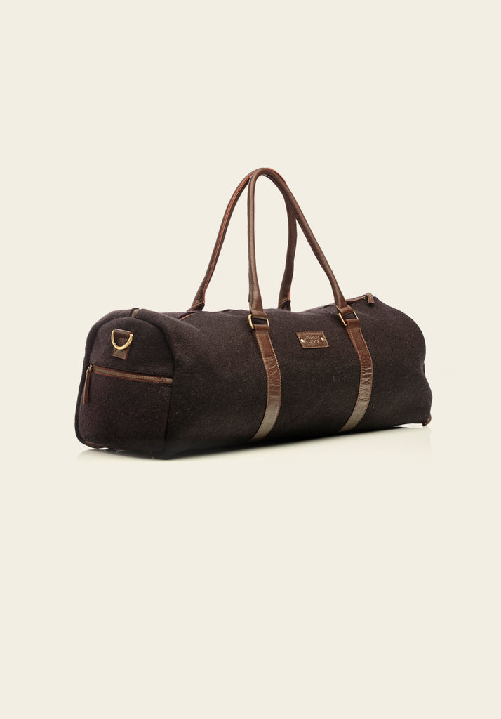 The Weekender - Midnight Brown - side view of the bag with pocket detail